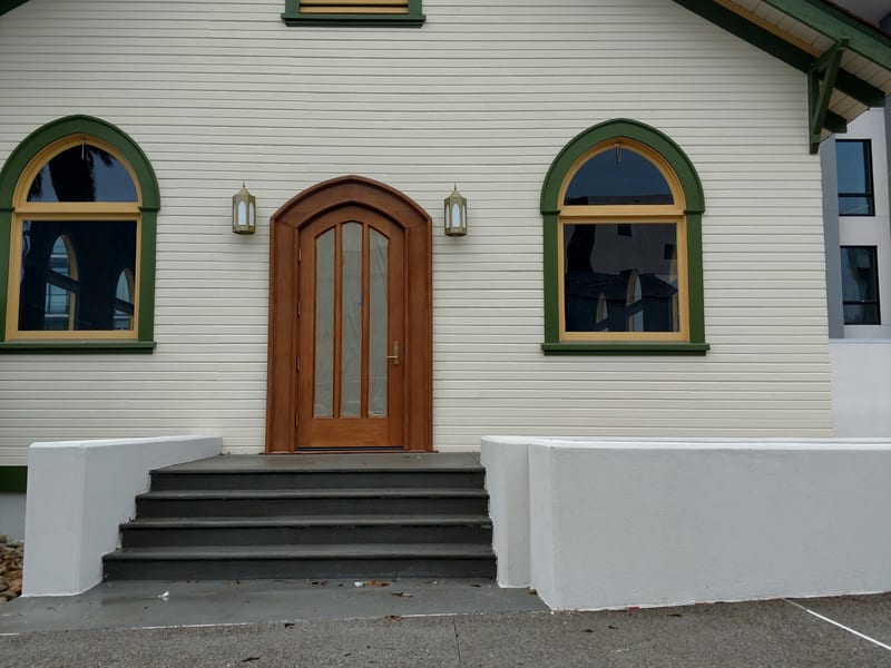 East Village Church after restoration — restored arched entrance and new steps, 2018