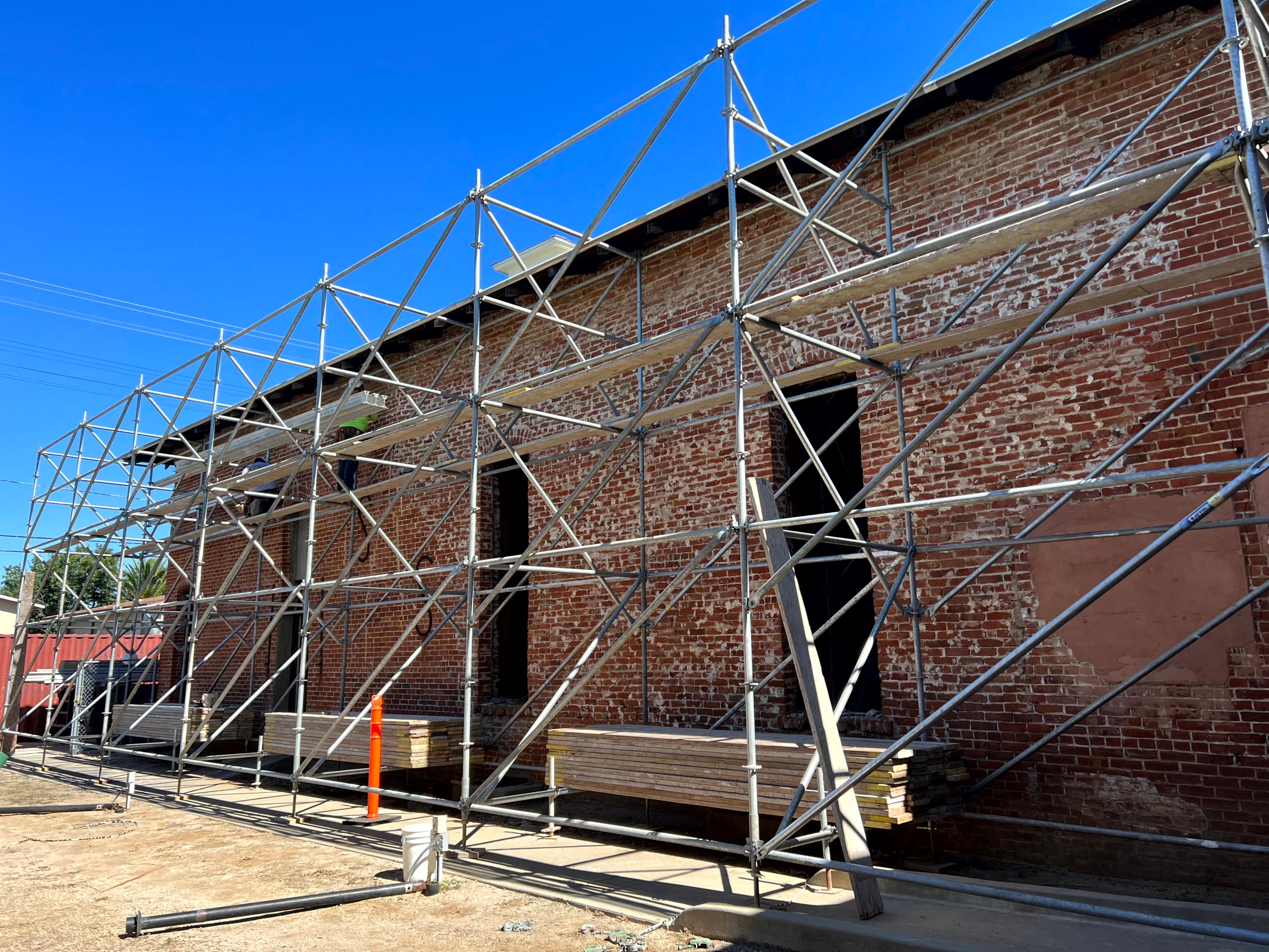Ramona Town Hall brick building under construction with scaffolding