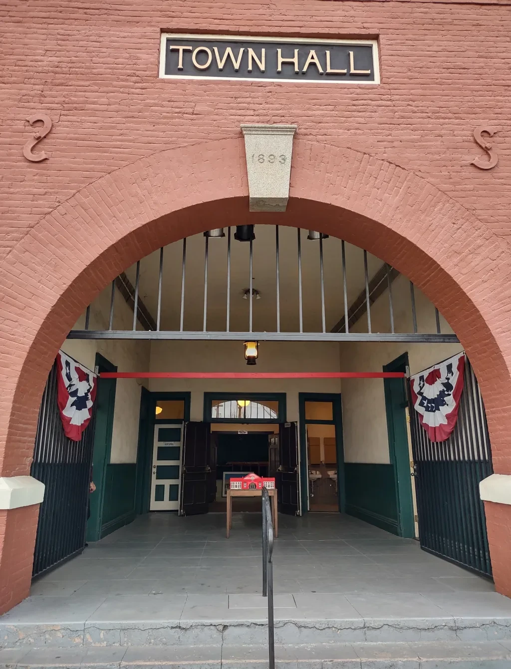 Ramona Town Hall arched entrance with 1893 keystone and green doors